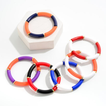 Tube Bead Stretch Bracelet with Gold Tone Accents